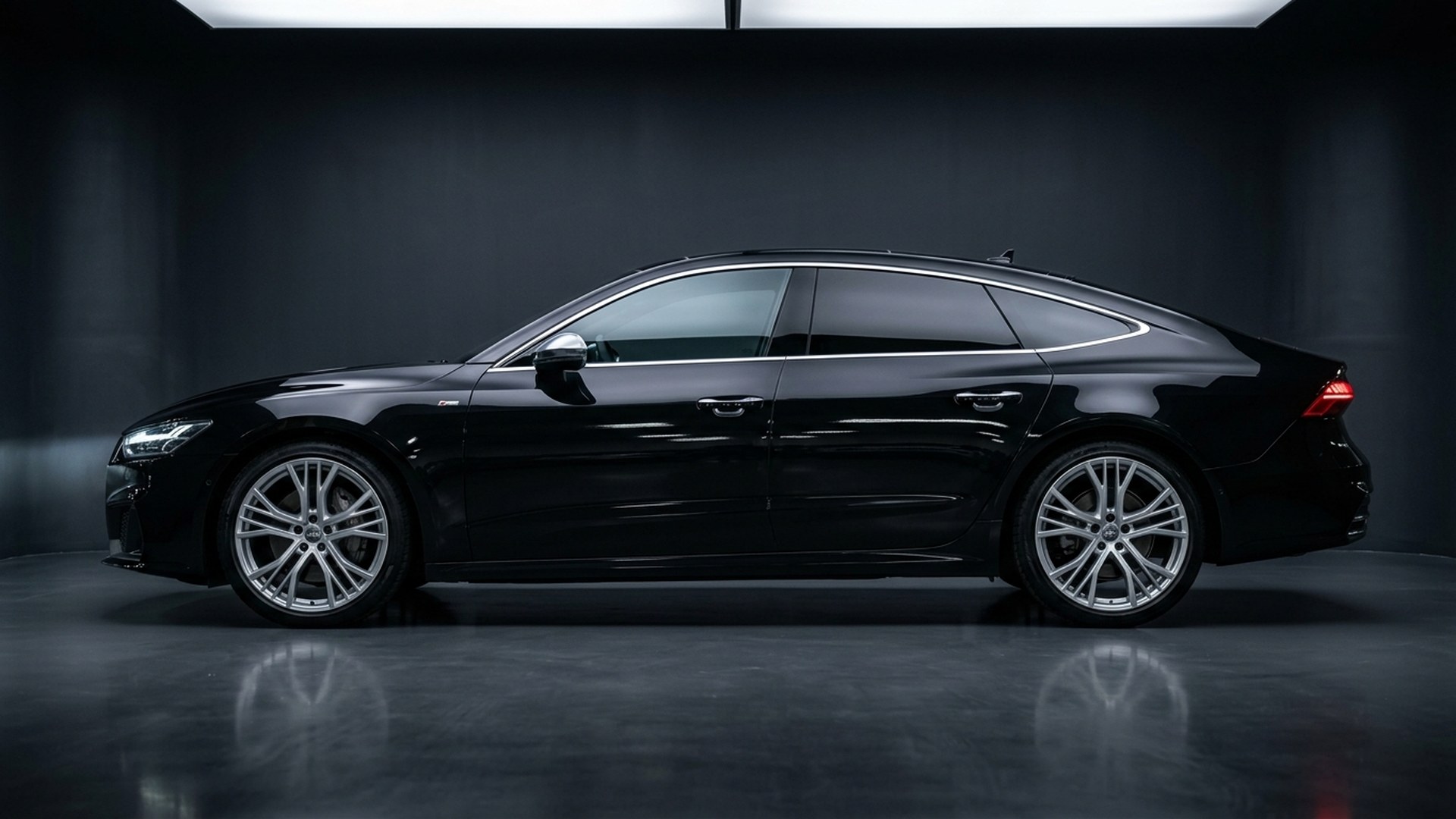 Qt hotel chauffeur melbourne - Sleek Audi luxury chauffeur sedan parked outside boutique designer hotel